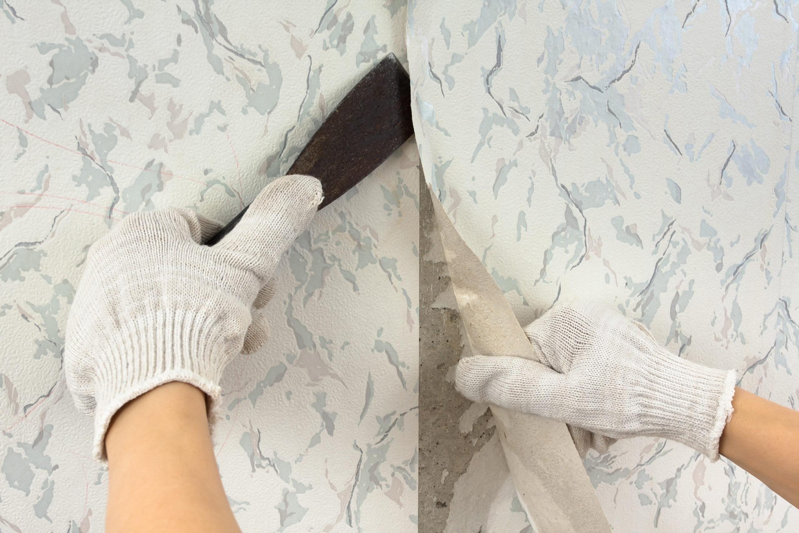 Hands,In,Glove,Removing,Old,Wallpaper,With,Spatula,During,Repair