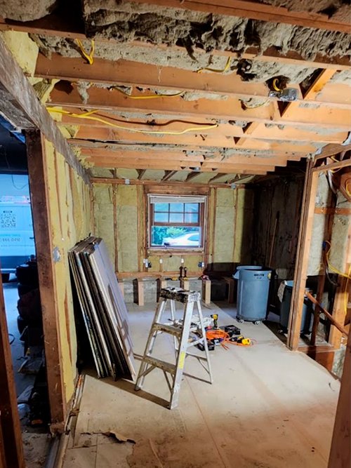 Professional skim coat application on interior walls